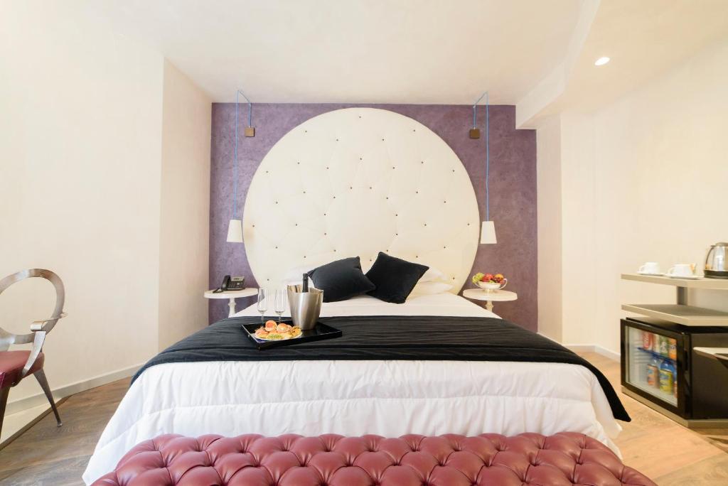 Postel nebo postele na pokoji v ubytování Hotel Vespasiano