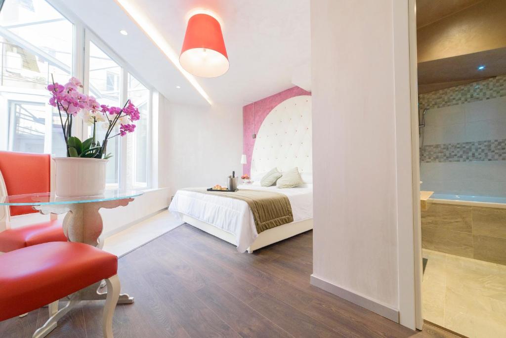Postel nebo postele na pokoji v ubytování Hotel Vespasiano