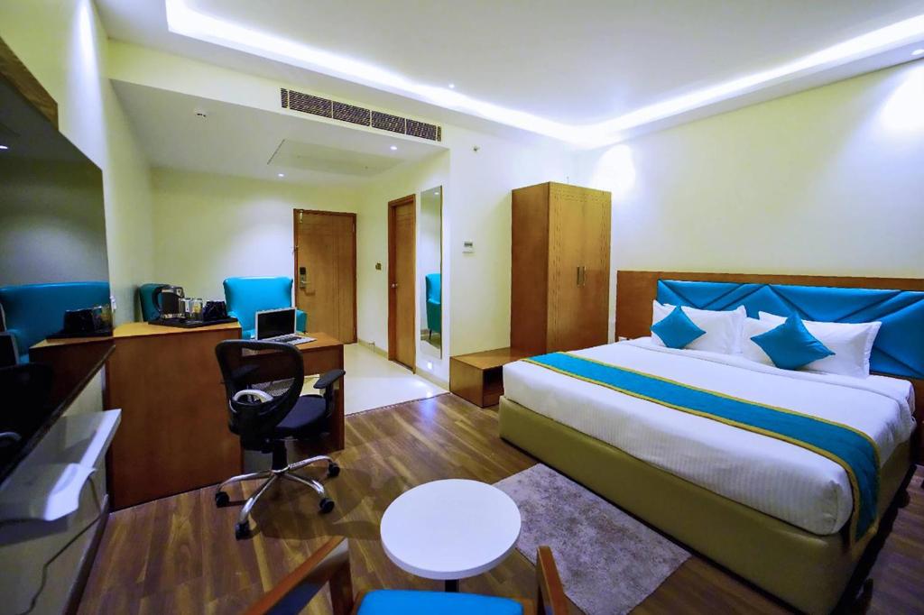 Postel nebo postele na pokoji v ubytování Quality Inn Rockwell Grand, Bangalore