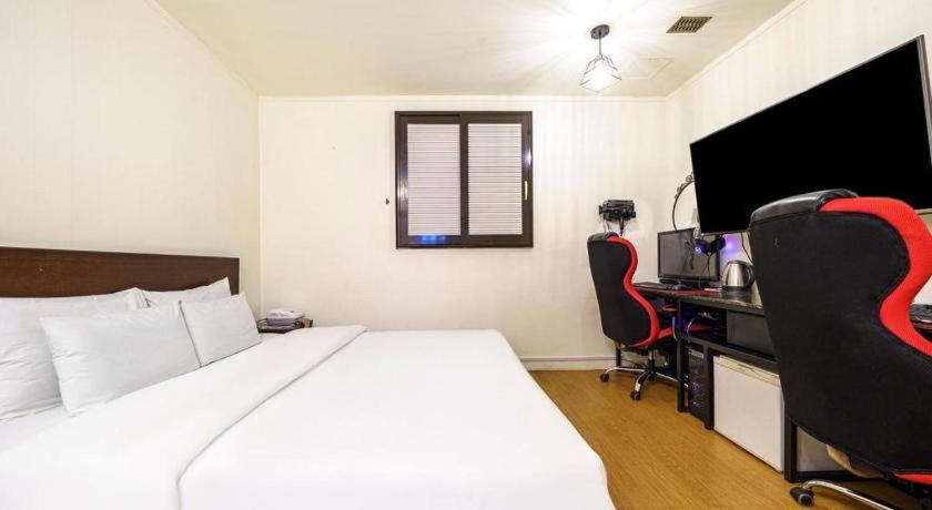 Postel nebo postele na pokoji v ubytování Yongin Valentine