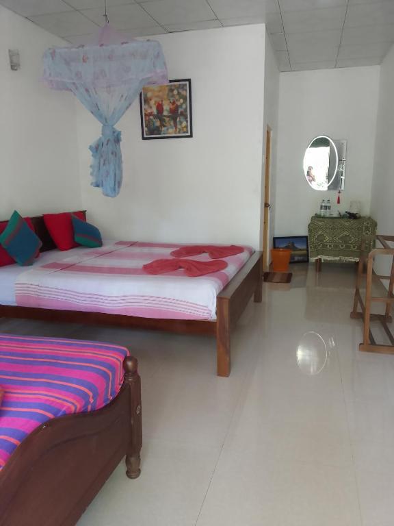 Postel nebo postele na pokoji v ubytování Freedom Home Stay