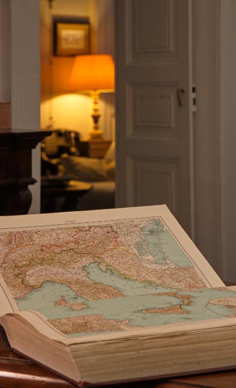a map on top of a book on a table at Masseria Il Frantoio in Ostuni