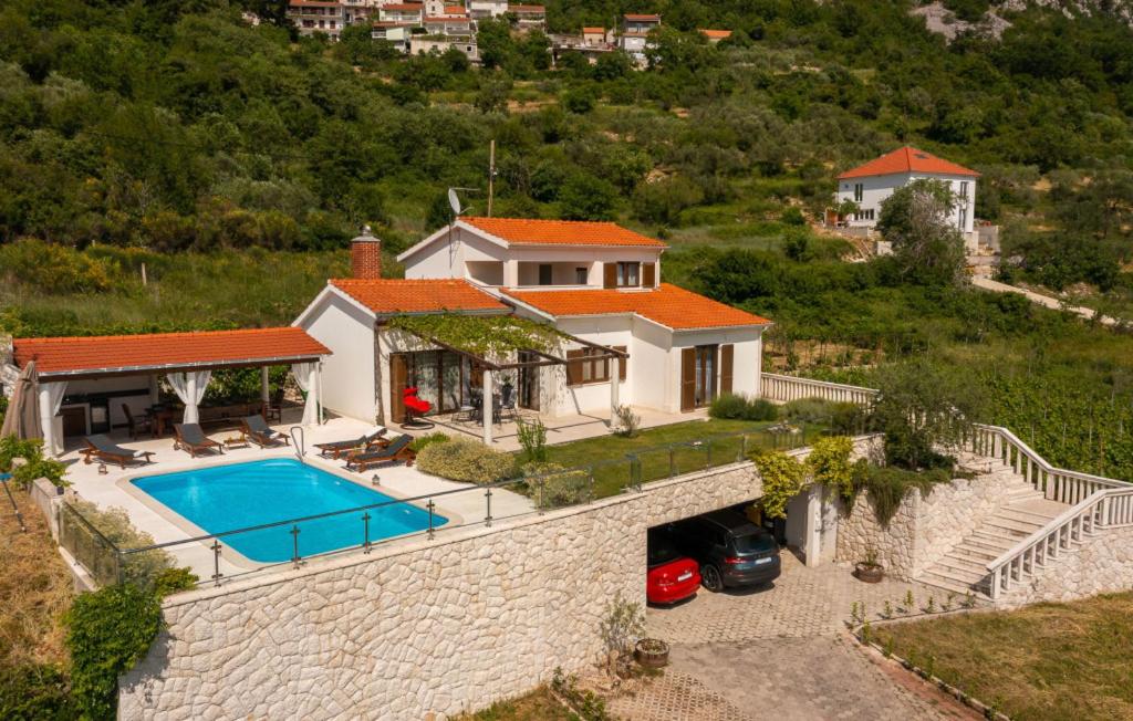 an aerial view of a house with a swimming pool at Villa Filomena - Omis by Villas Guide in Blato na Cetini