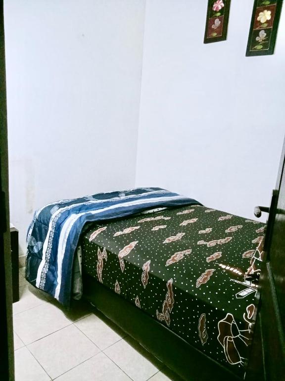 Postel nebo postele na pokoji v ubytování Guest House Abimanyu