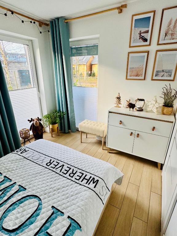 Łóżko lub łóżka w pokoju w obiekcie Apartament Baltic A8 Pobierowo