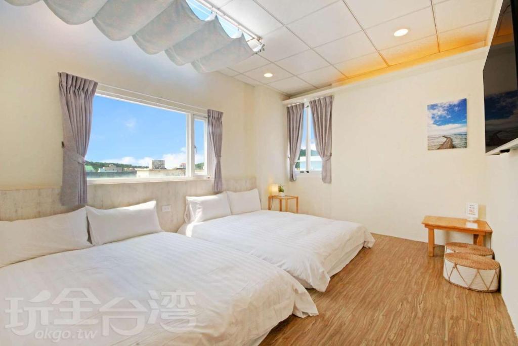Giường trong phòng chung tại Lu Dao Homestay