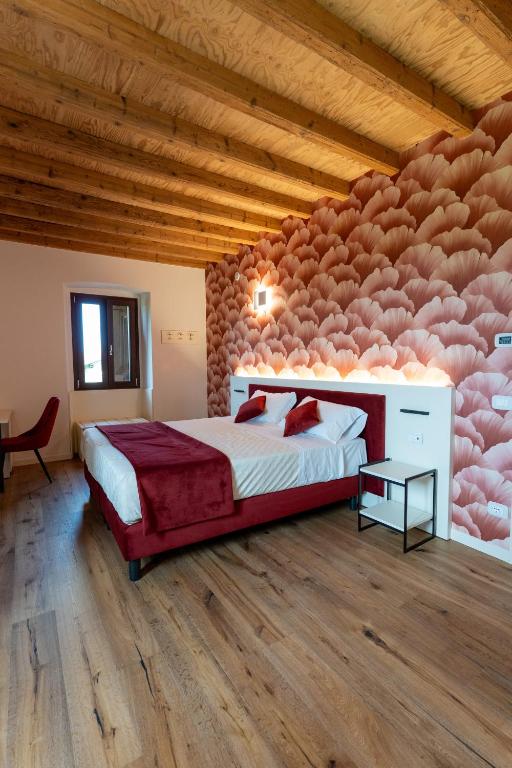 Postel nebo postele na pokoji v ubytování 4 Elementi Relais B&B Lonato del Garda