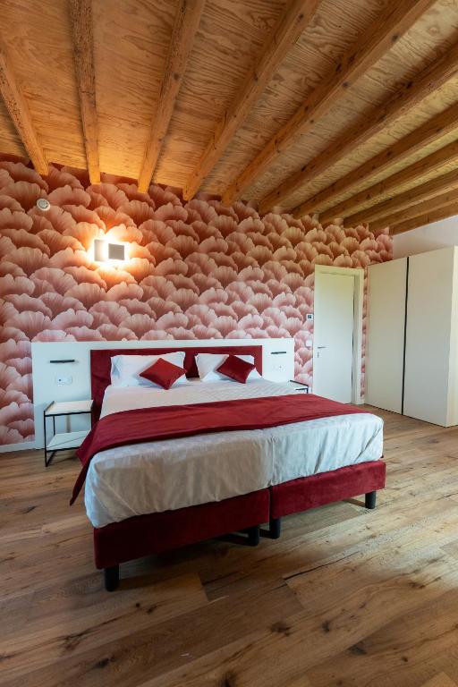 Postel nebo postele na pokoji v ubytování 4 Elementi Relais B&B Lonato del Garda