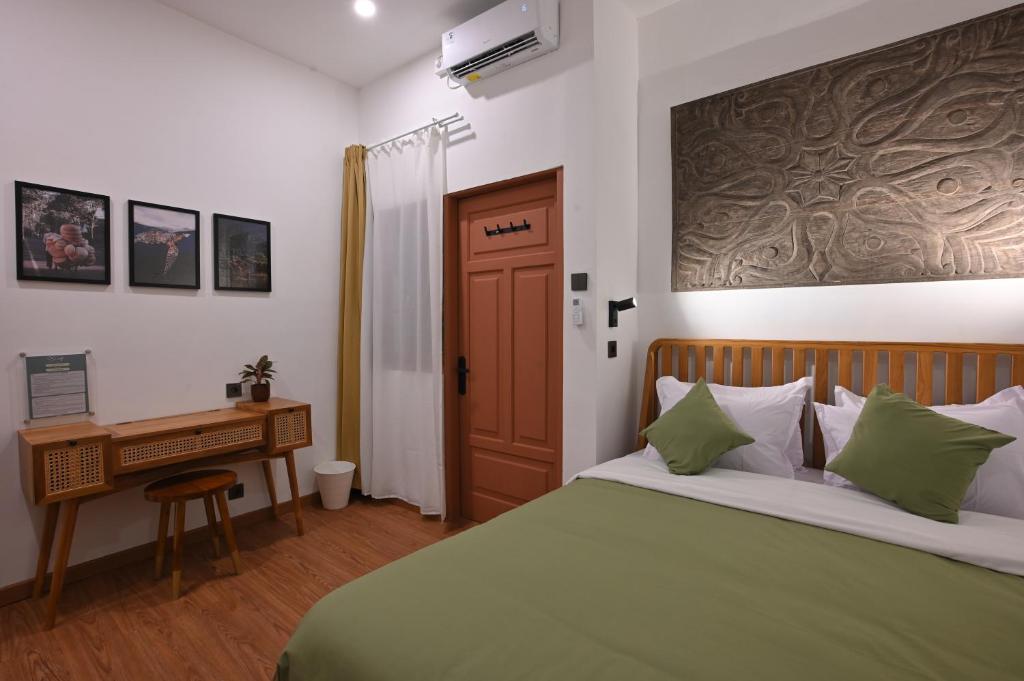 Postel nebo postele na pokoji v ubytování Huma Yogyakarta Hostel