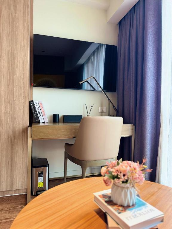 TV a/nebo společenská místnost v ubytování The Residences at Novotel Tower