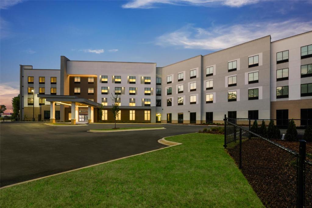 a large white building with a parking lot at Hampton Inn & Suites By Hilton Decatur in Decatur