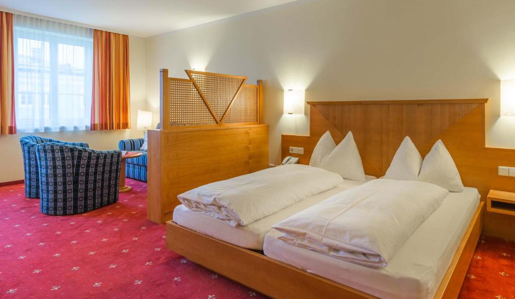 Postel nebo postele na pokoji v ubytování Posthotel Radstadt