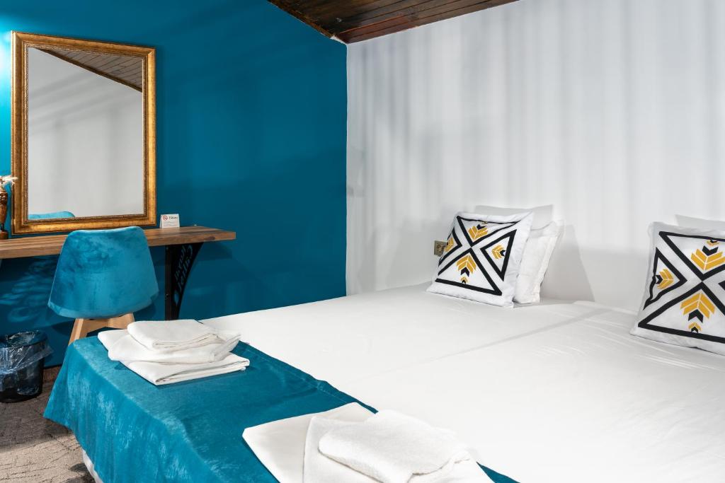 Postel nebo postele na pokoji v ubytování Royal Calisto Hotel