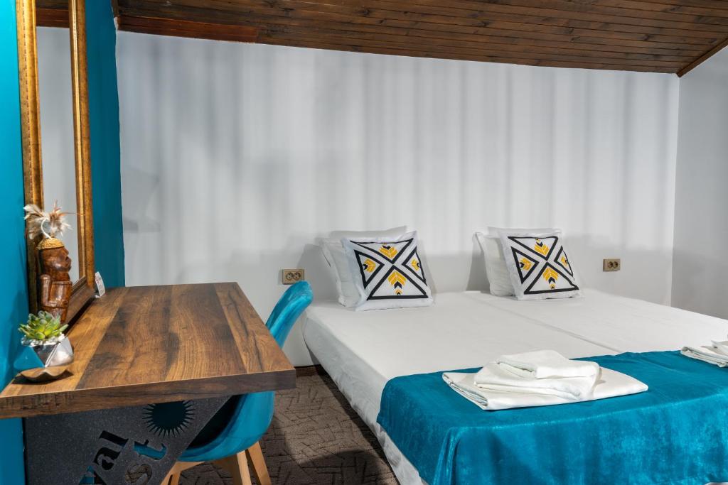 Postel nebo postele na pokoji v ubytování Royal Calisto Hotel
