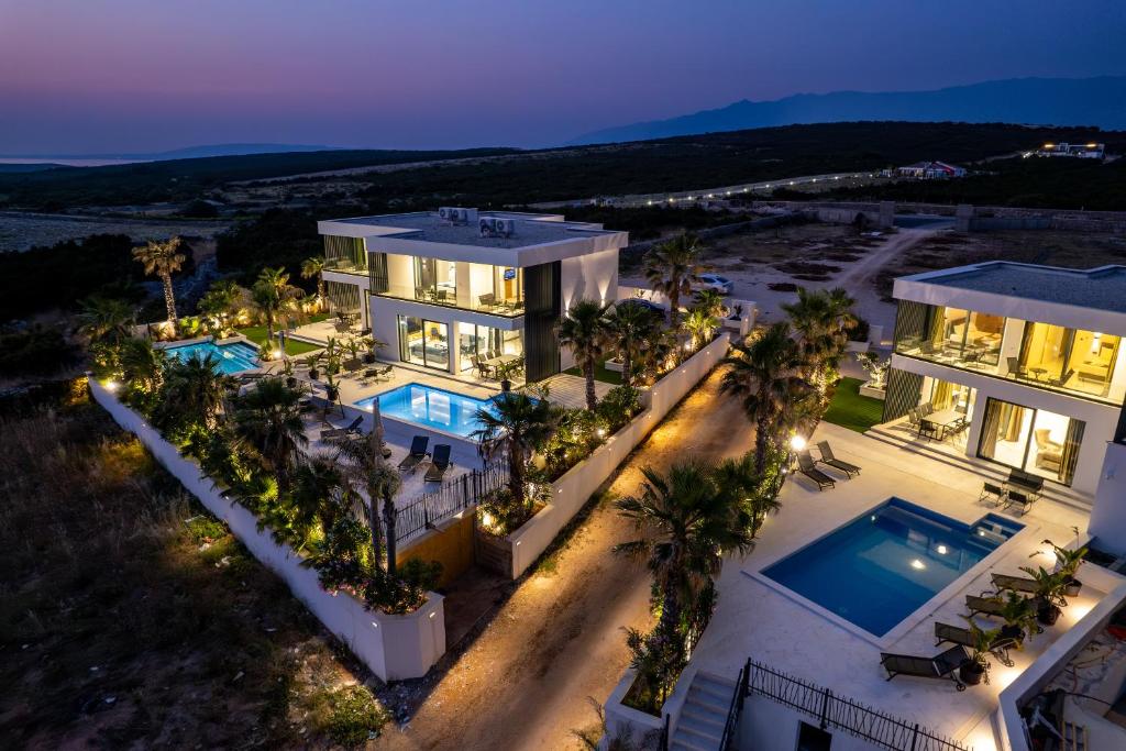 an aerial view of a house with a swimming pool at Villa Dubai in Novalja