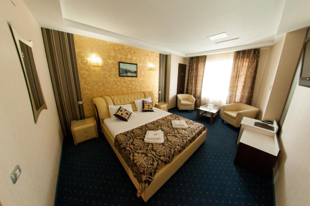 Postel nebo postele na pokoji v ubytování Hotel Boutique Shine
