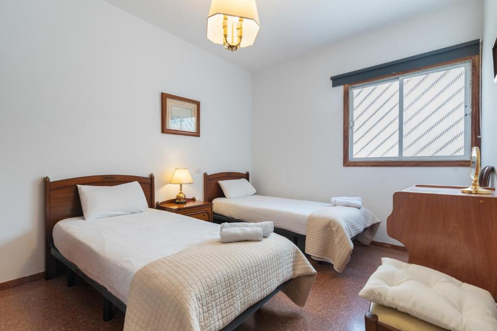 Posteľ alebo postele v izbe v ubytovaní Penthouse Parque Santa Catalina- Ruvimag