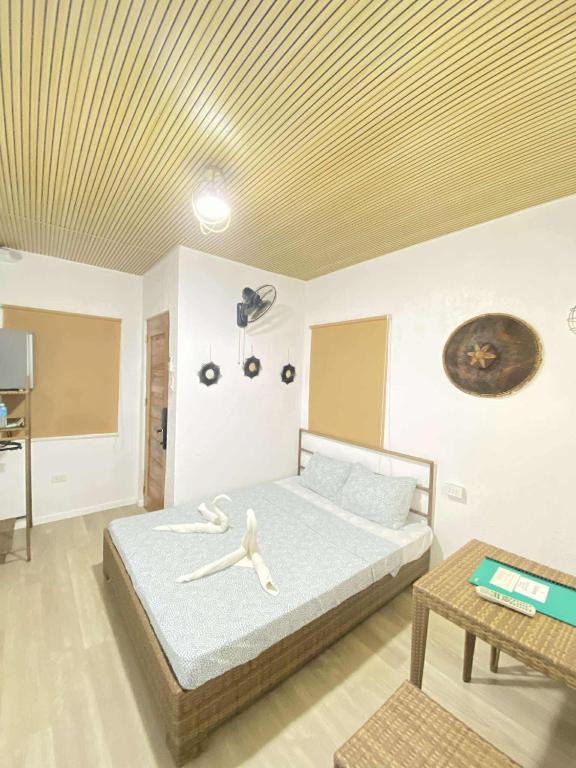 Postel nebo postele na pokoji v ubytování Ecostay Panglao Resort Hotel