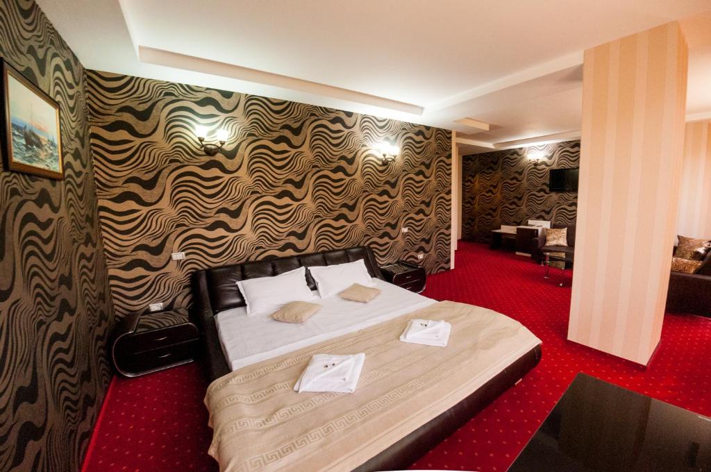 Postel nebo postele na pokoji v ubytování Hotel Boutique Shine
