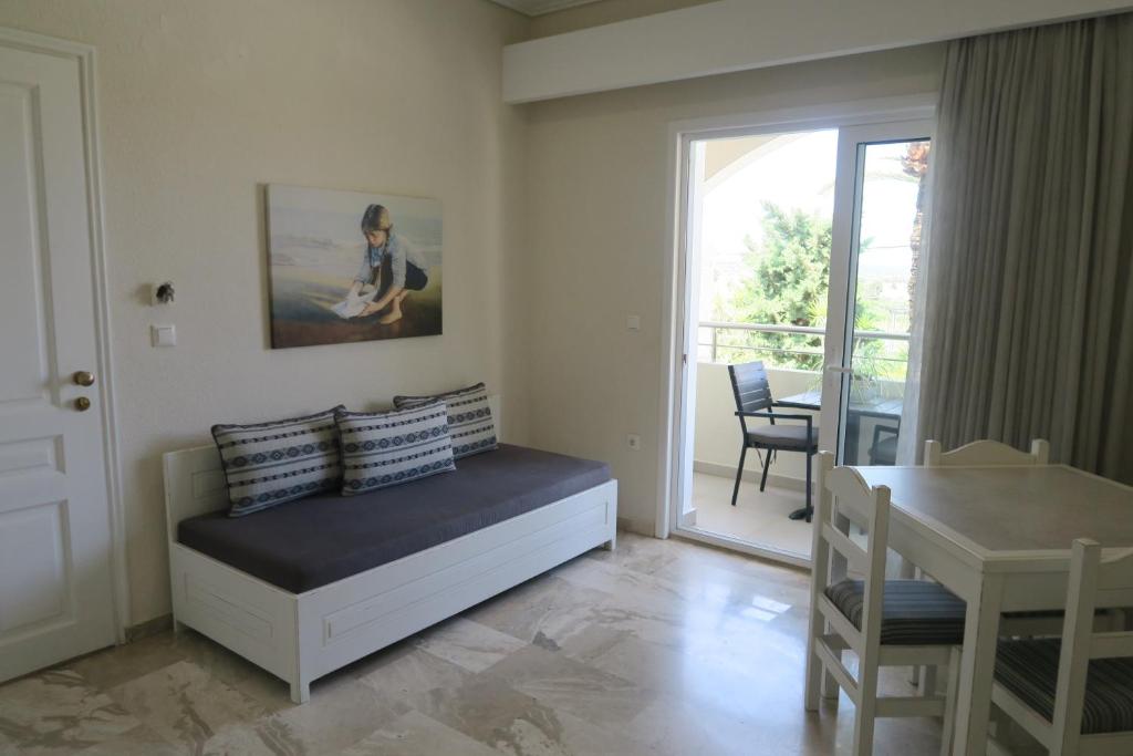 Postel nebo postele na pokoji v ubytování Maria Suites