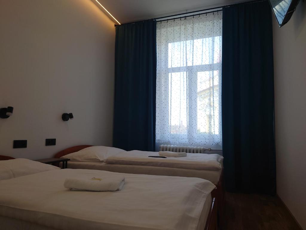 Postel nebo postele na pokoji v ubytování Hotel Central