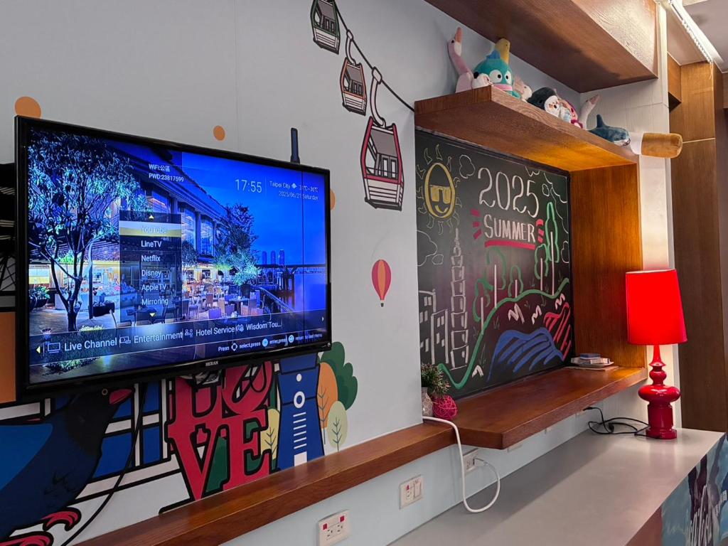 TV a/nebo společenská místnost v ubytování 新麗旅店 Newful Hotel