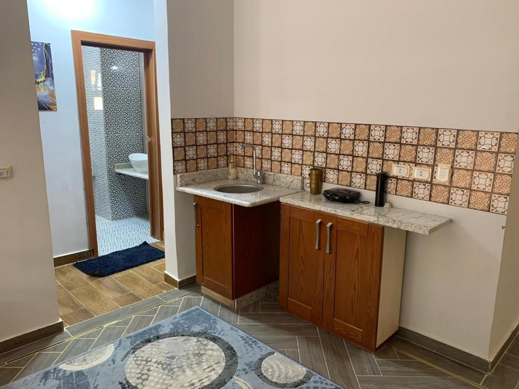 a bathroom with a sink and a shower at Villa waterway 2 in Cairo