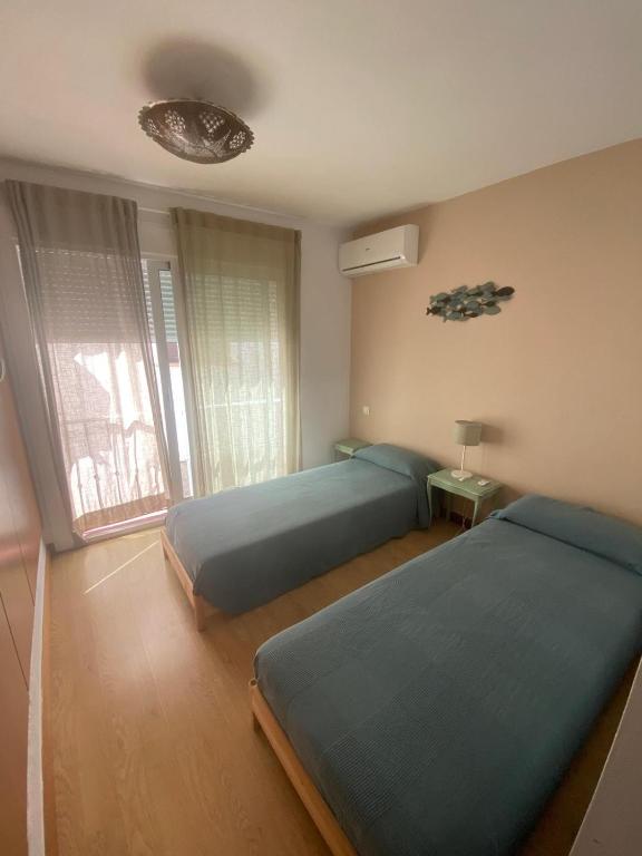 Postel nebo postele na pokoji v ubytování La Casa Alhambra