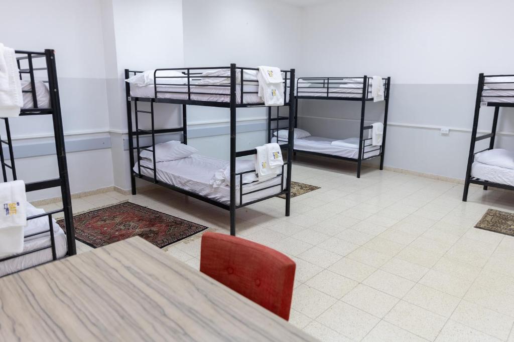 Postel nebo postele na pokoji v ubytování New Gate Hostel
