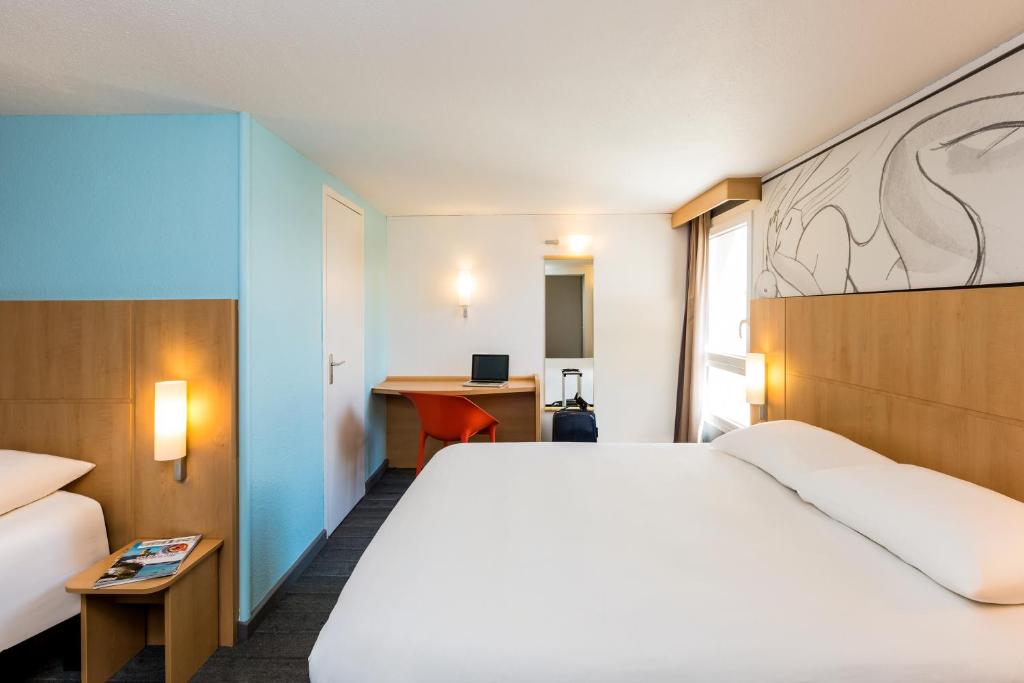 Postel nebo postele na pokoji v ubytování Ibis Roscoff