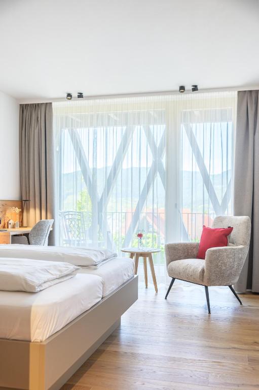 Postel nebo postele na pokoji v ubytování Hotel Die Alm
