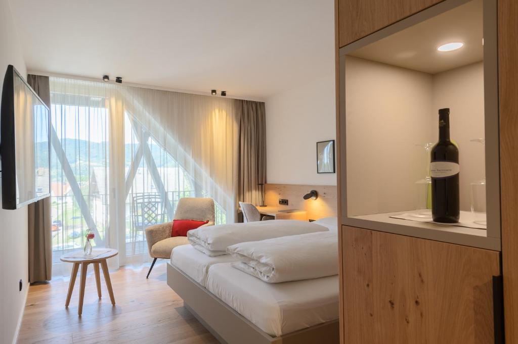 Postel nebo postele na pokoji v ubytování Hotel Die Alm