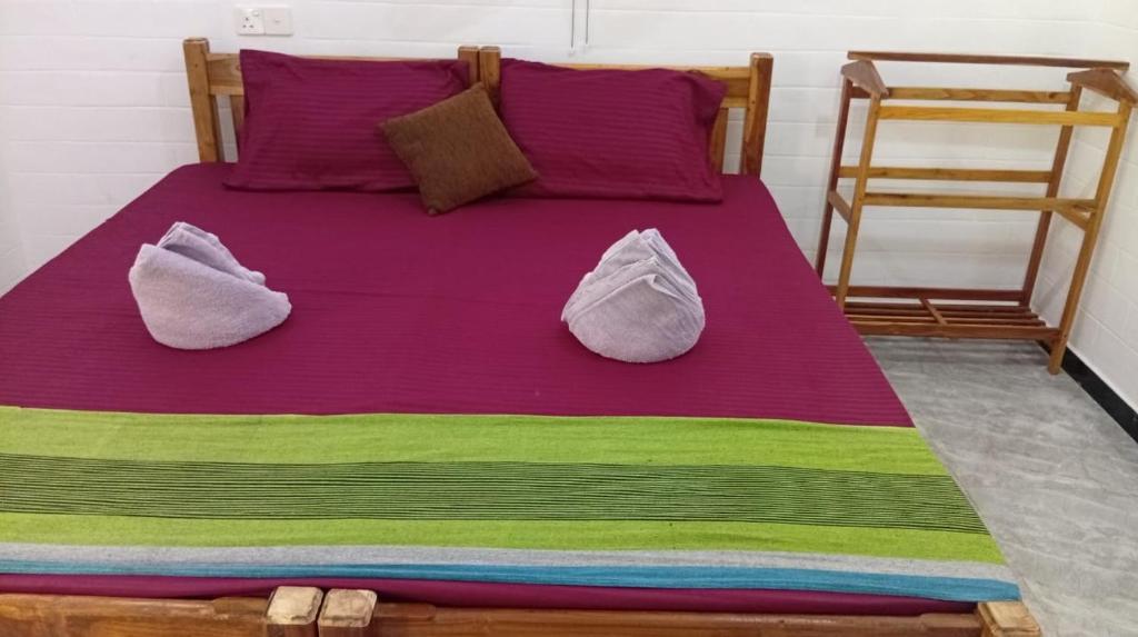 Postel nebo postele na pokoji v ubytování Pearl Bungalow Trincomalee