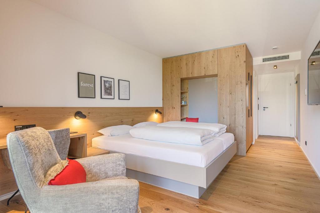Postel nebo postele na pokoji v ubytování Hotel Die Alm