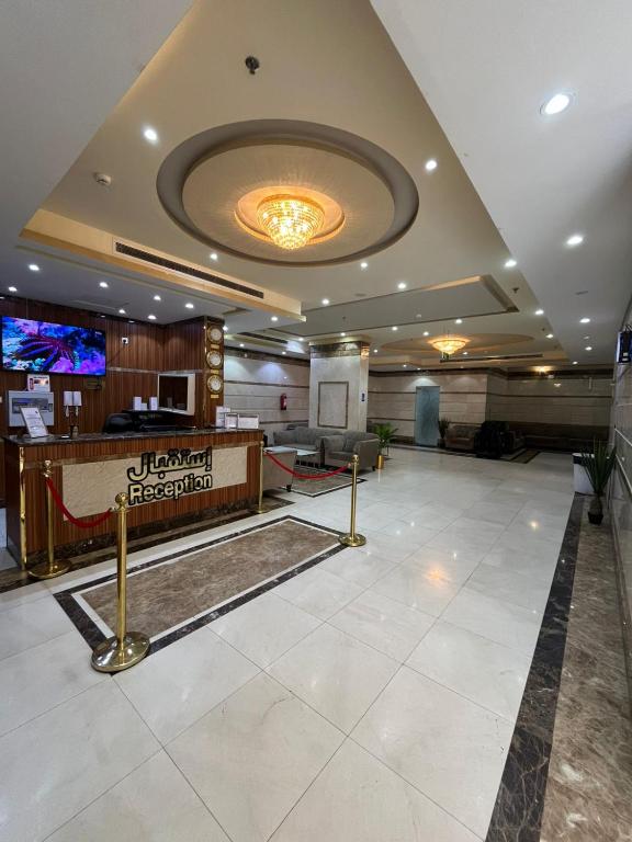 a lobby of a hotel with a reception desk at AL-Diyafh Hotel in Az Zāhir