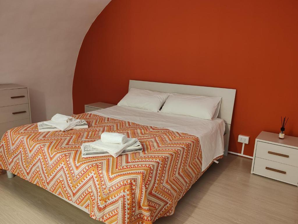 a bedroom with a bed with two towels on it at Casa al Mare in Bisceglie