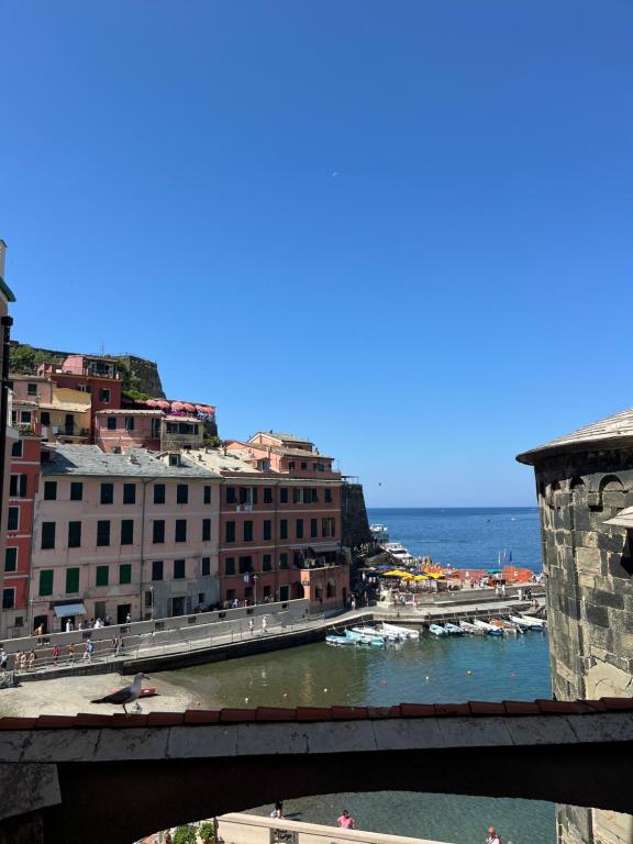a bridge over a body of water with buildings at Nicolina 5 Il Cappero in Vernazza