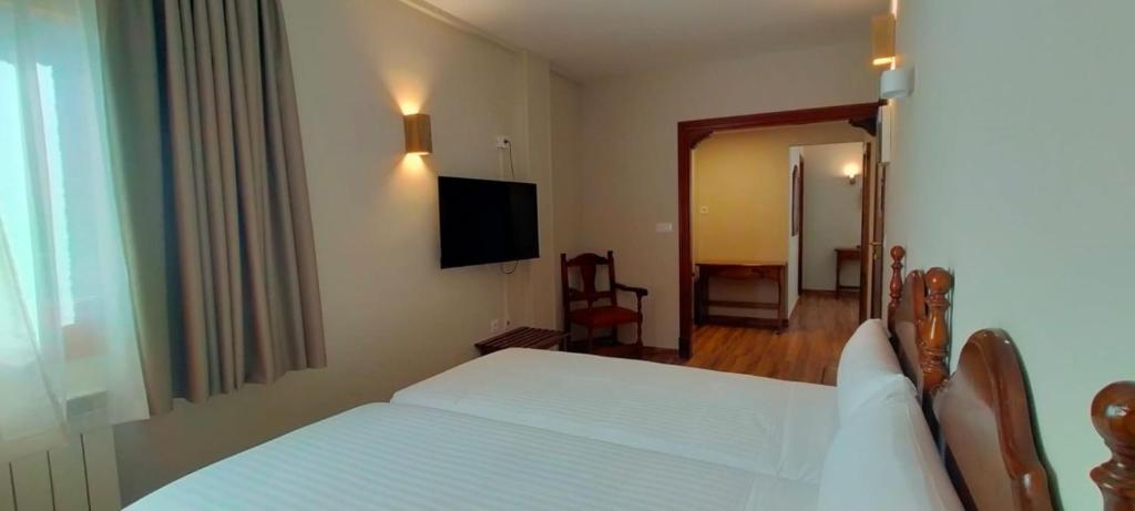 Postel nebo postele na pokoji v ubytování Edelweiss Hotel