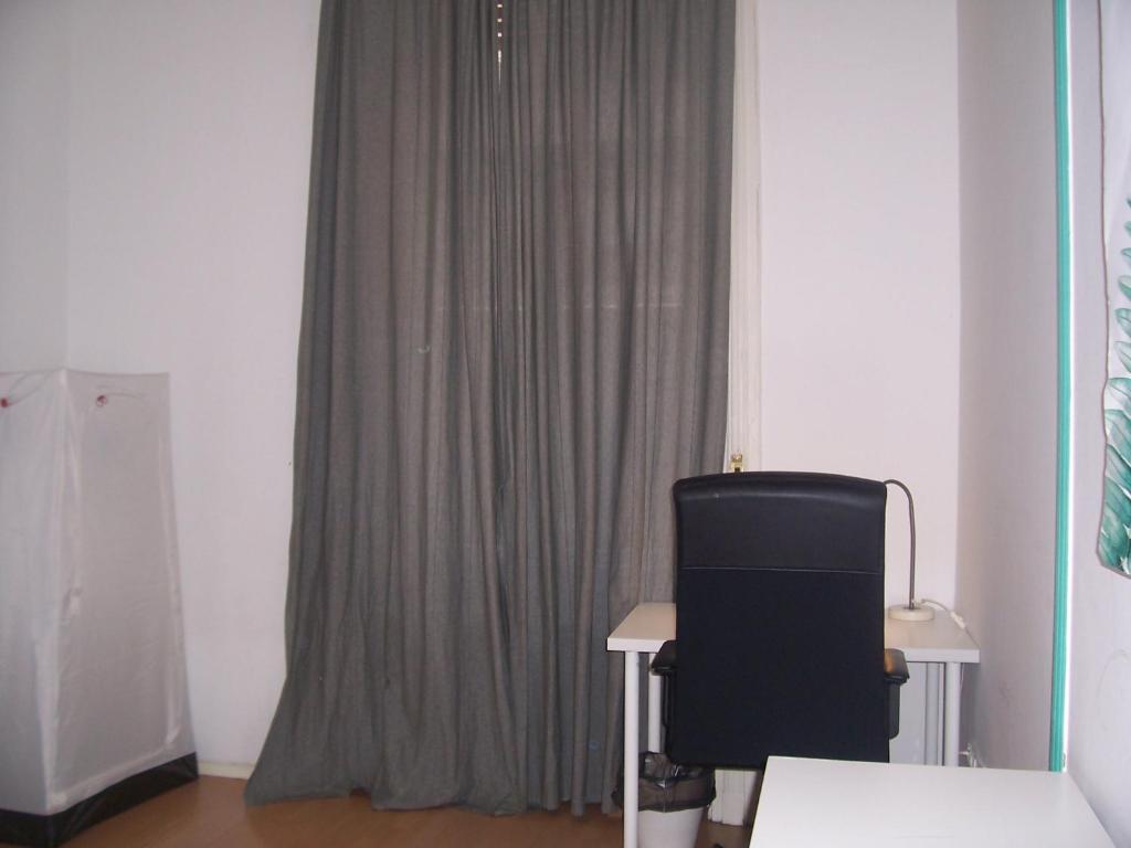 Televízia a/alebo spoločenská miestnosť v ubytovaní Spark Apartment