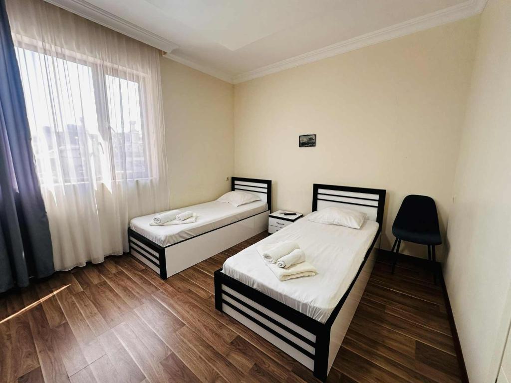 Postel nebo postele na pokoji v ubytování KISI Hotel