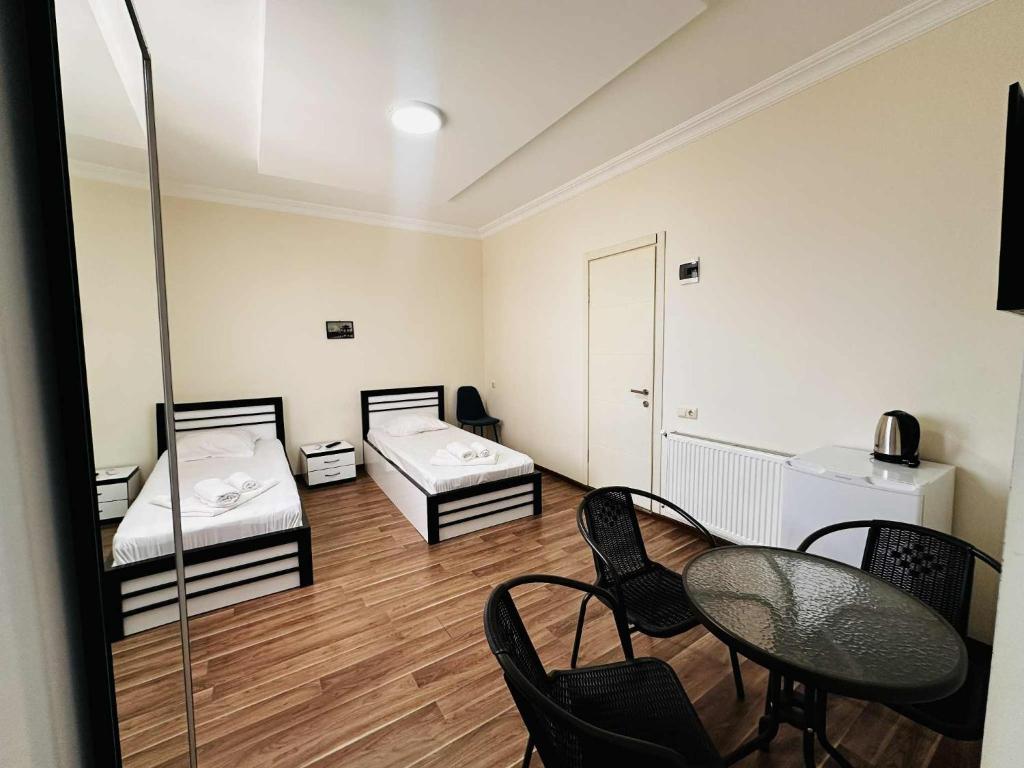 Postel nebo postele na pokoji v ubytování KISI Hotel