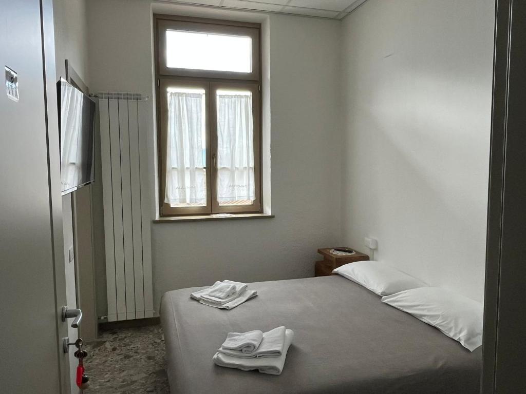 Postel nebo postele na pokoji v ubytování foresteria ca' mon