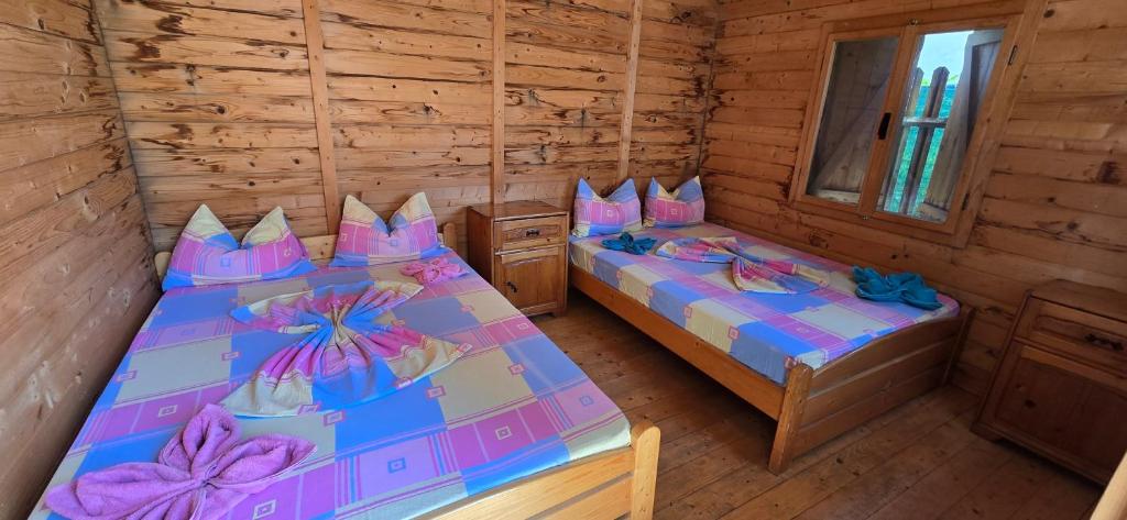 Postel nebo postele na pokoji v ubytování Camere Orizont