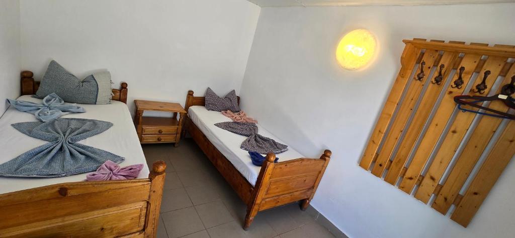 Postel nebo postele na pokoji v ubytování Camere Orizont