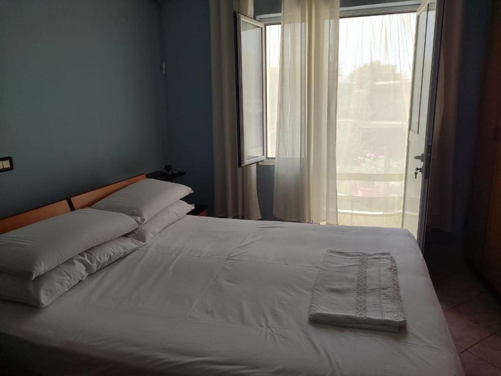 Postel nebo postele na pokoji v ubytování Vlora House