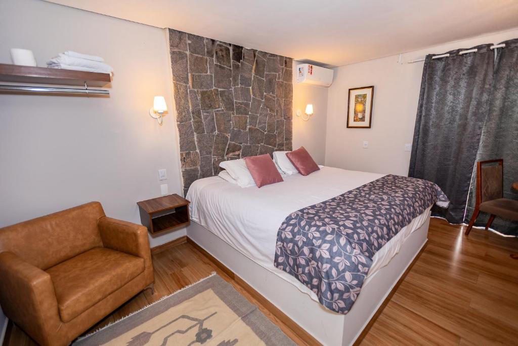 Ένα ή περισσότερα κρεβάτια σε δωμάτιο στο Villa Hegus chales com hidro ar lareira