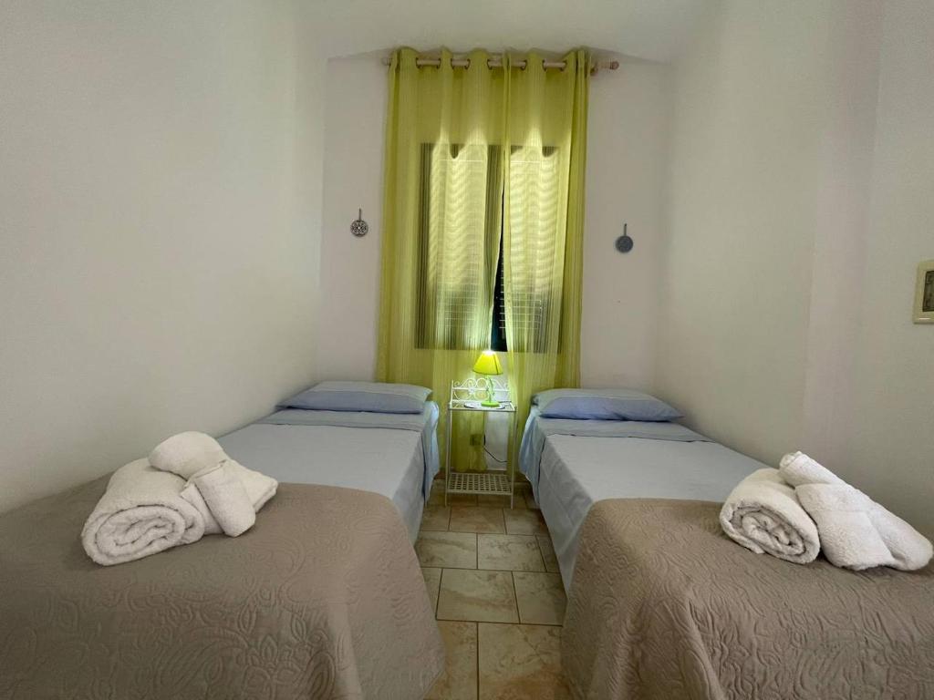 Letto o letti in una camera di Casa Vacanza ORO BLU DEL SALENTO