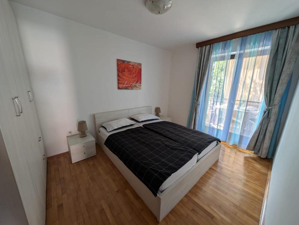 Posteľ alebo postele v izbe v ubytovaní Apartments Jurišević