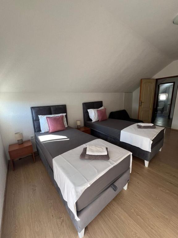 Postel nebo postele na pokoji v ubytování Apartman Nina2