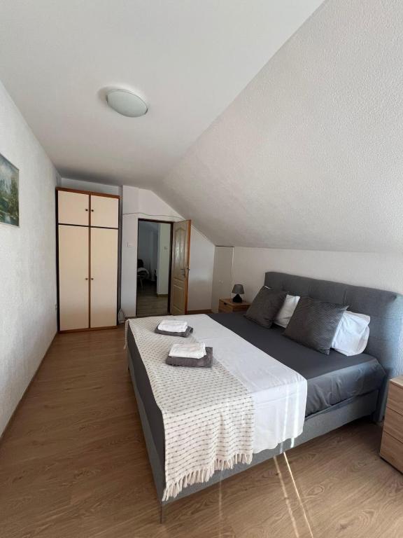 Postel nebo postele na pokoji v ubytování Apartman Nina2